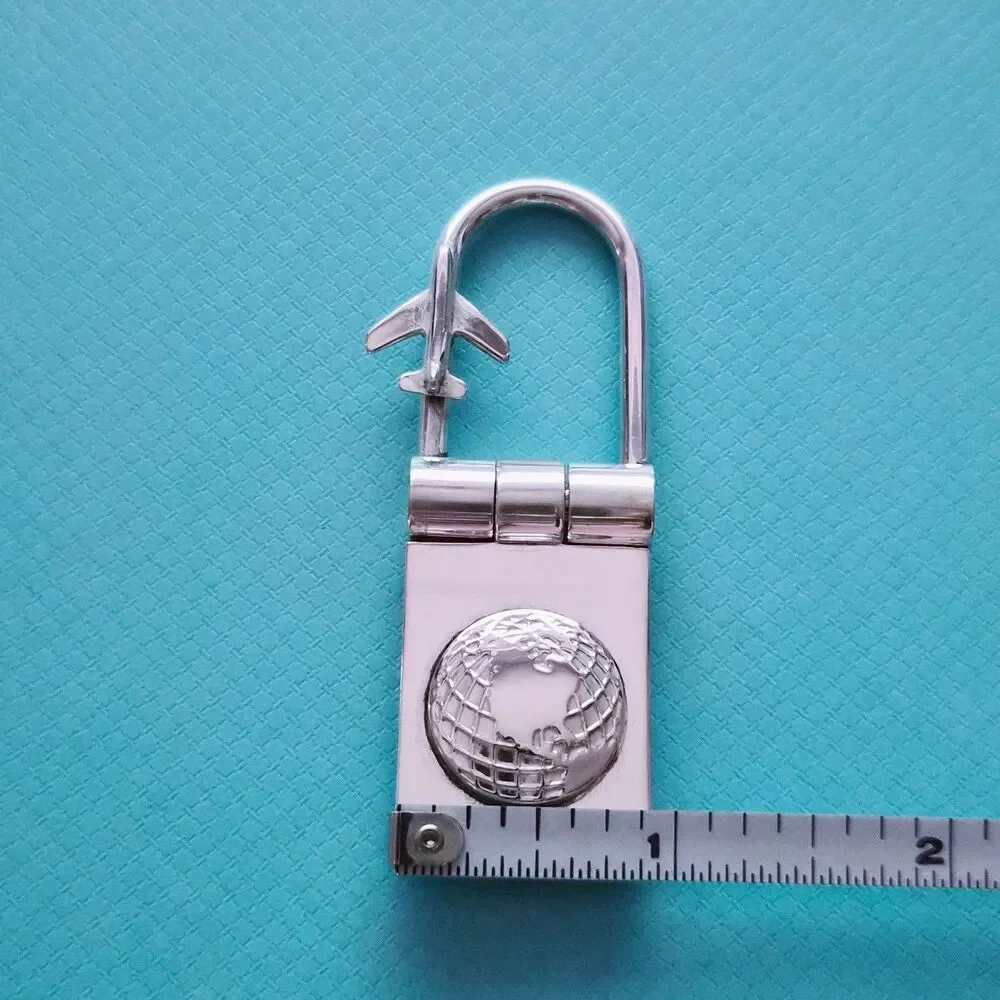 RARE Tiffany & Co. Sterling Silver Globe & Airplane Travel Lock Key Ring